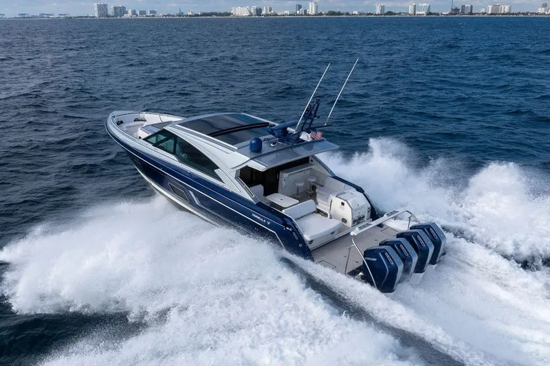 Slide: The Image of 2025 Formula 500 Super Sport Crossover cruising on open water, showcasing sleek design and powerful engines. - 29