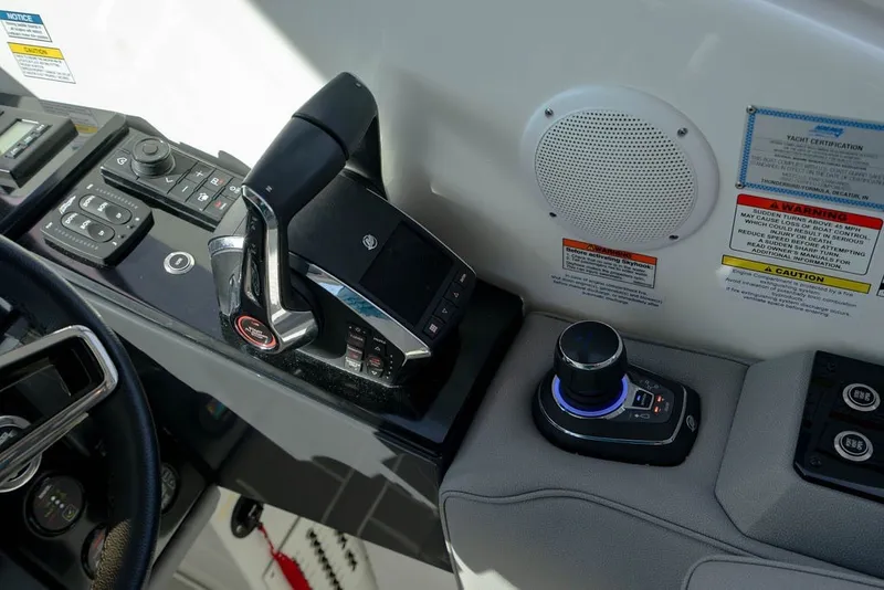 Slide: The Image of Control panel of 2025 Formula 500 Super Sport Crossover boat with joystick and throttle. - 91