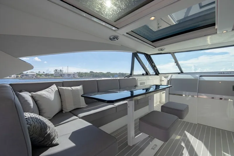 Slide: The Image of Luxurious interior of 2025 Formula 500 Super Sport Crossover yacht with sleek seating and table. - 97