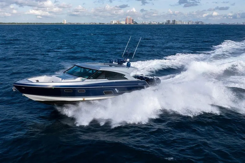 Slide: The Image of 2025 Formula 500 Super Sport Crossover cruising on open water with city skyline in background. - 24
