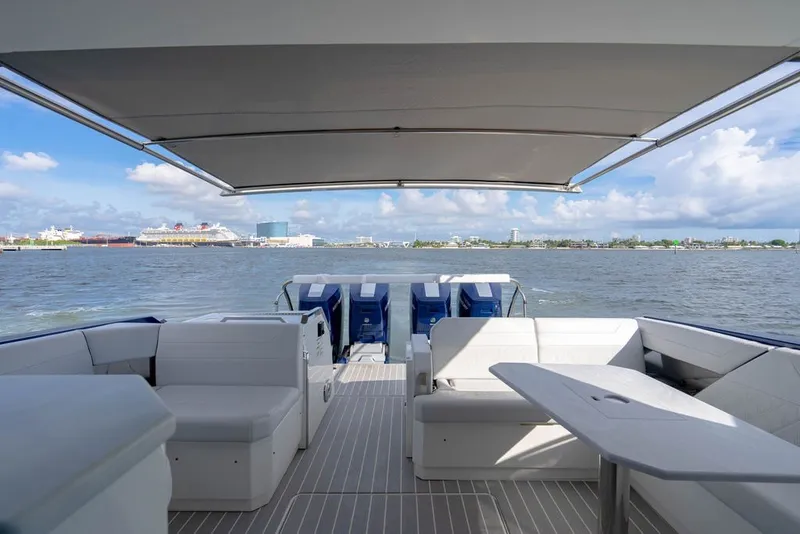 Slide: The Image of 2025 Formula 500 Super Sport Crossover boat interior with seating, table, and ocean view. - 71