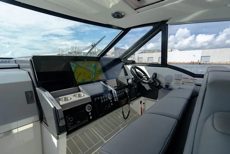 Slide: The Image of Interior of 2025 Formula 500 Super Sport Crossover boat with modern dashboard and navigation system. - 93