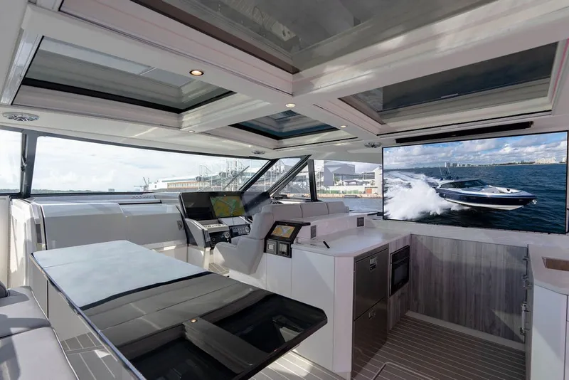 Slide: The Image of Interior of 2025 Formula 500 Super Sport Crossover yacht with modern design and large screen. - 102