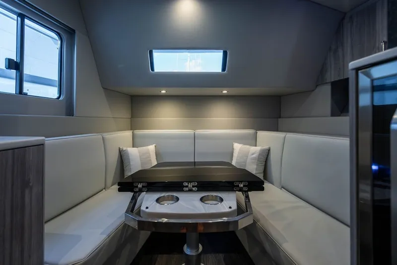 Slide: The Image of Luxurious interior of 2025 Formula 500 Super Sport Crossover with modern seating and table. - 37
