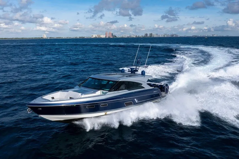 Slide: The Image of 2025 Formula 500 Super Sport Crossover cruising on open water, city skyline in background. - 21