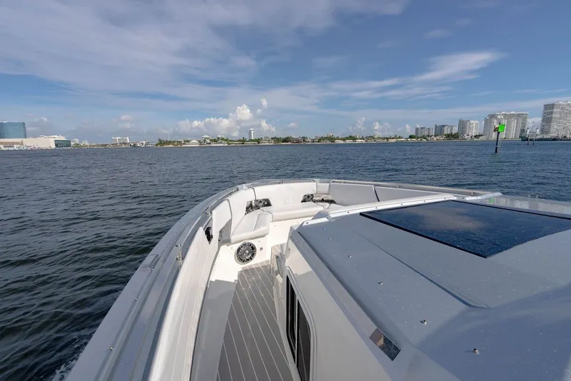 Slide: The Image of 2025 Formula 500 Super Sport Crossover boat cruising on a sunny day near city skyline. - 112