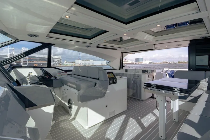 Slide: The Image of Luxurious interior of 2025 Formula 500 Super Sport Crossover yacht with modern seating and panoramic views. - 109