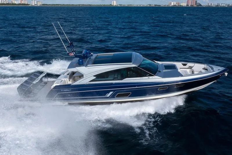 Slide: The Image of 2025 Formula 500 Super Sport Crossover cruising on open water, showcasing sleek design and performance. - 17
