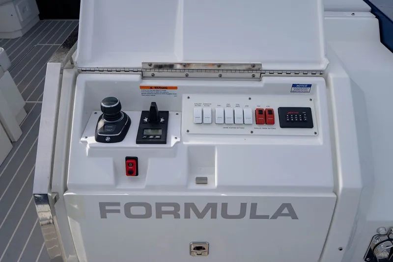 Slide: The Image of Control panel of 2025 Formula 500 Super Sport Crossover boat with joystick and switches. - 65