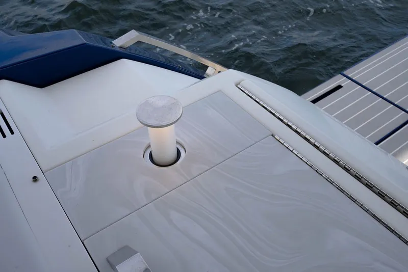 Slide: The Image of 2025 Formula 500 Super Sport Crossover boat deck detail with water in the background. - 68