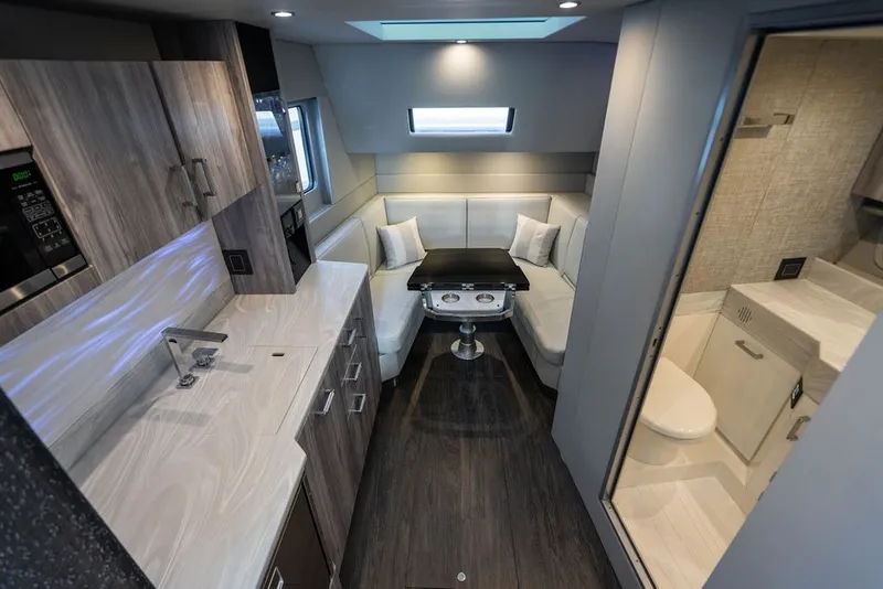Slide: The Image of Luxurious interior of 2025 Formula 500 Super Sport Crossover with modern kitchen and seating area. - 36
