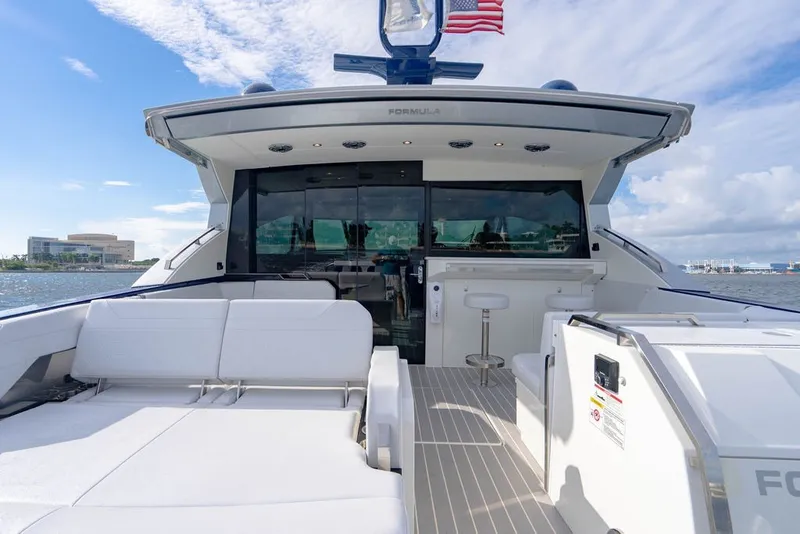 Slide: The Image of 2025 Formula 500 Super Sport Crossover yacht with luxurious seating and sleek design. - 58