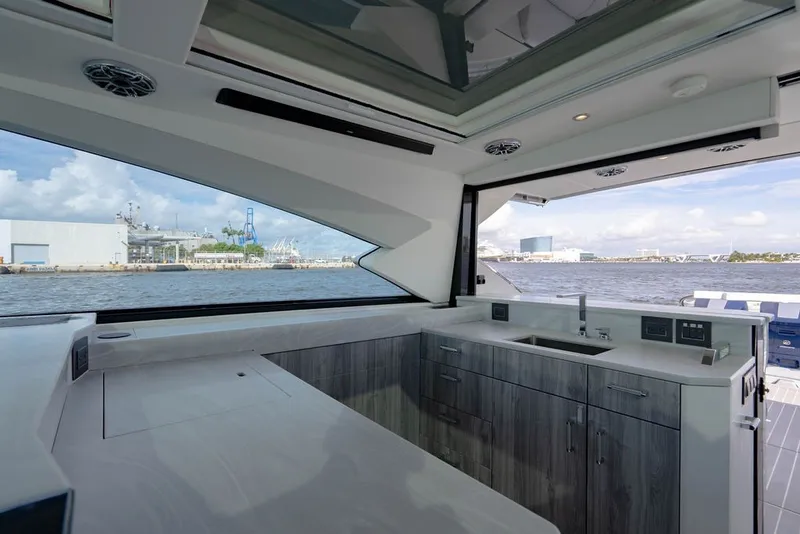 Slide: The Image of Interior view of 2025 Formula 500 Super Sport Crossover yacht with modern kitchen design. - 85