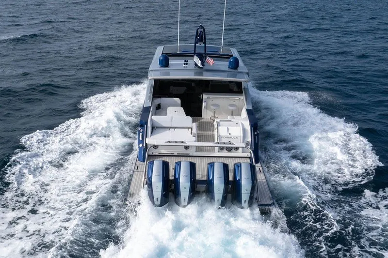 Slide: The Image of 2025 Formula 500 Super Sport Crossover cruising on open water, rear view. - 30