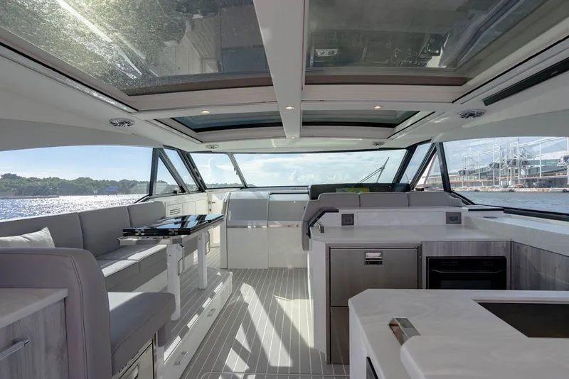 Slide: The Image of Luxurious interior of 2025 Formula 500 Super Sport Crossover yacht with panoramic windows. - 79