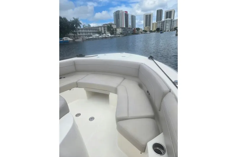 Slide: The Image of 2018 Pursuit S 368 Sport boat interior with waterfront cityscape view. - 25