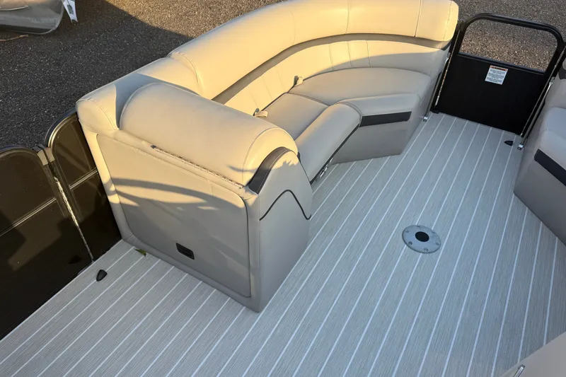 Slide: The Image of 2019 South Bay 224E pontoon boat interior with beige seating and striped flooring. - 14