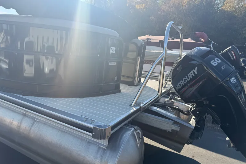 Slide: The Image of 2019 South Bay 224E pontoon boat with Mercury 60 HP engine in sunlight. - 8