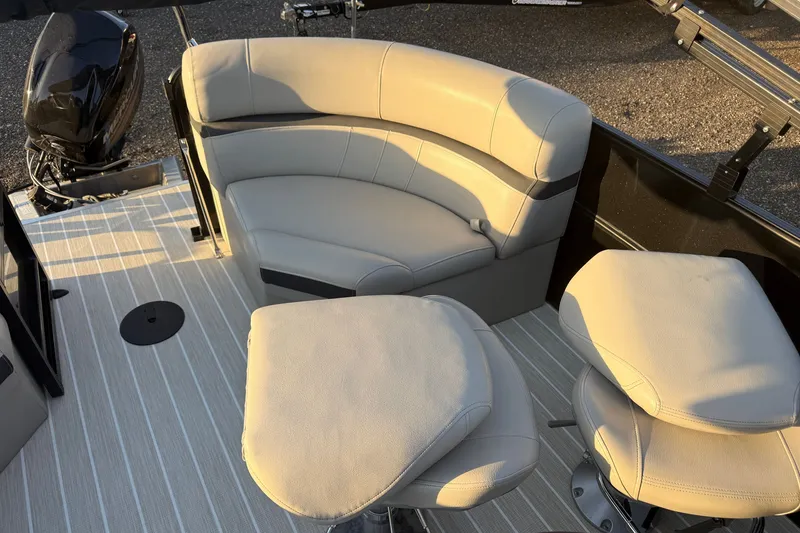Slide: The Image of 2019 South Bay 224E boat interior with beige seating and striped flooring. - 11