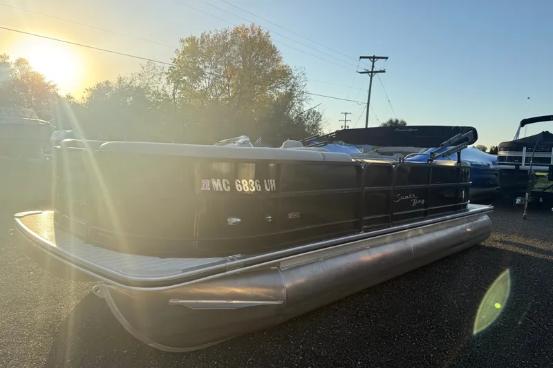 Slide: The Image of 2019 South Bay 224E pontoon boat in a sunlit outdoor setting. - 1