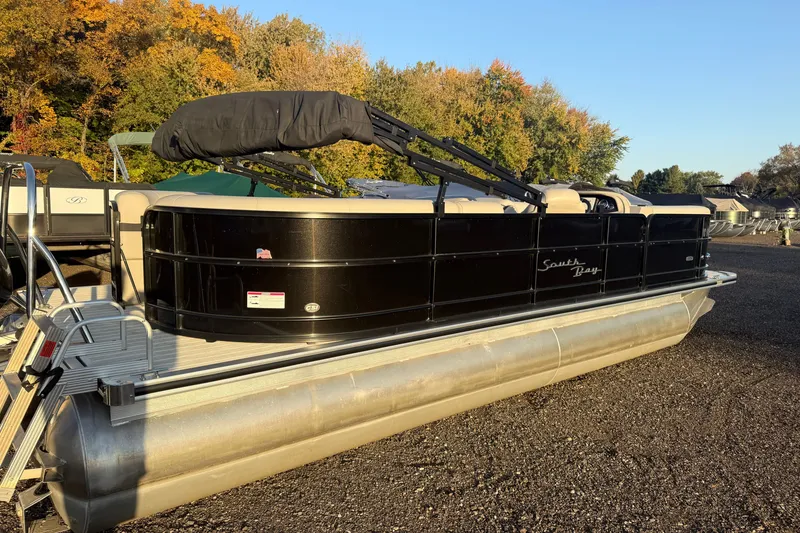 Slide: The Image of 2019 South Bay 224E pontoon boat in a scenic outdoor setting. - 3