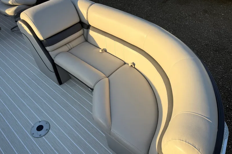 Slide: The Image of Luxurious seating on 2019 South Bay 224E boat, featuring beige upholstery and sleek design. - 18