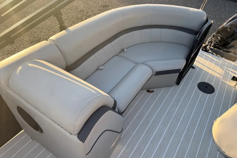 Slide: The Image of Luxurious seating on a 2019 South Bay 224E pontoon boat, featuring elegant upholstery. - 10