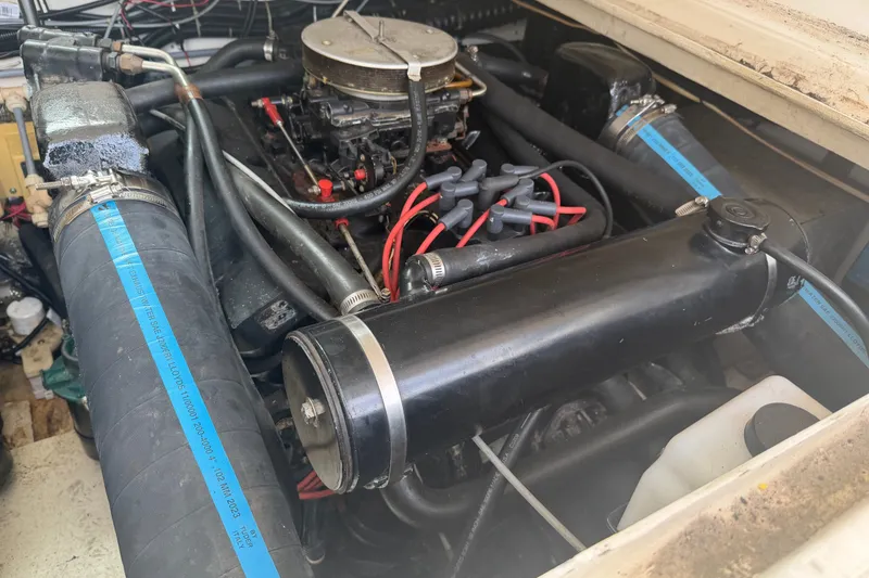 Slide: The Image of Engine compartment of a 1996 Pursuit 3100 Express boat, showcasing detailed components. - 10