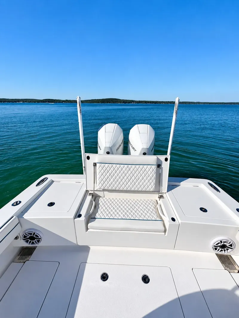 Slide: The Image of The image shows the stern of a 2025 Valhalla V-29 Hybrid with dual engines and a bench seat. - 17