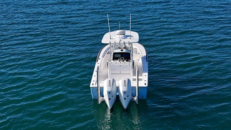 Slide: The Image of A 2025 Valhalla V-29 Hybrid on calm water with two outboard engines. - 9