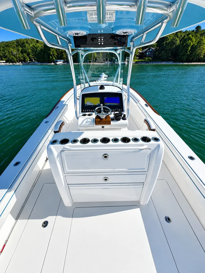 Slide: The Image of The image shows the cockpit of a 2025 Valhalla V-29 Hybrid on calm water. - 15