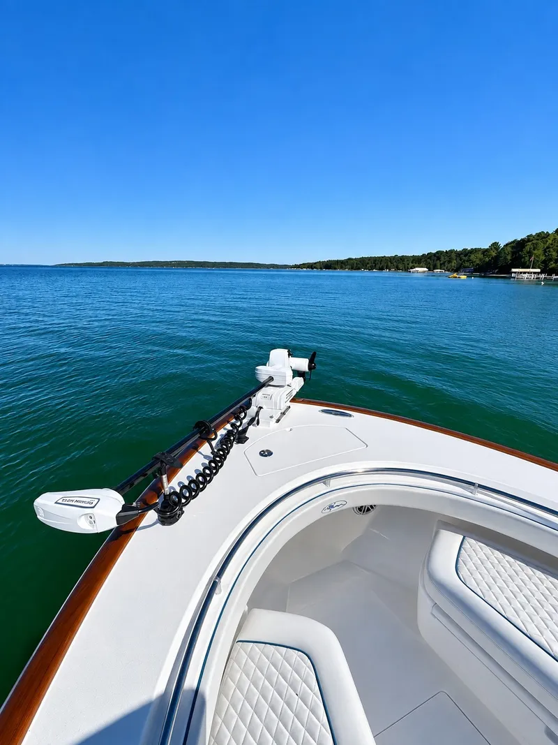 Slide: The Image of Valhalla V-29 Hybrid 2025 on calm water with clear skies. - 21