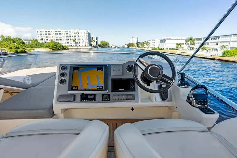 Slide: The Image of Luxury yacht helm with navigation system, Absolute 55 FLY, 2013 model, scenic waterfront view. - 31