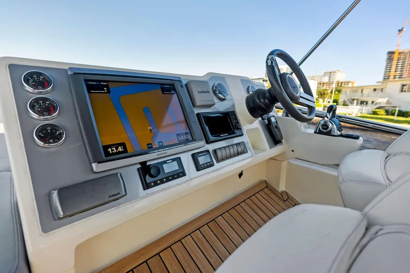Slide: The Image of Helm of 2013 Absolute 55 FLY yacht with navigation system and steering wheel. - 32