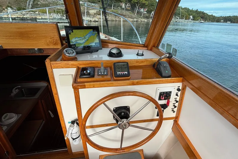 Slide: The Image of Helm of 1993 Webbers Cove Pemaquid Beach 26 with navigation equipment and wooden finish. - 14