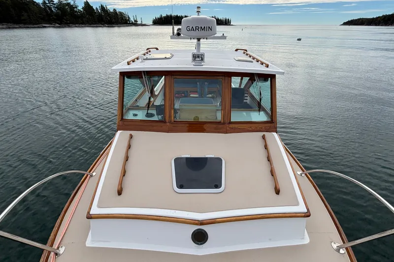 Slide: The Image of 1993 Webbers Cove Pemaquid Beach 26 boat on calm water, featuring Garmin equipment. - 33
