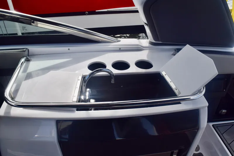 Slide: The Image of 2025 Monterey 275SS Super Sport boat interior with sleek sink and cup holders. - 54