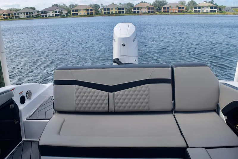 Slide: The Image of 2025 Monterey 275SS Super Sport boat interior with luxurious seating and scenic waterfront view. - 37