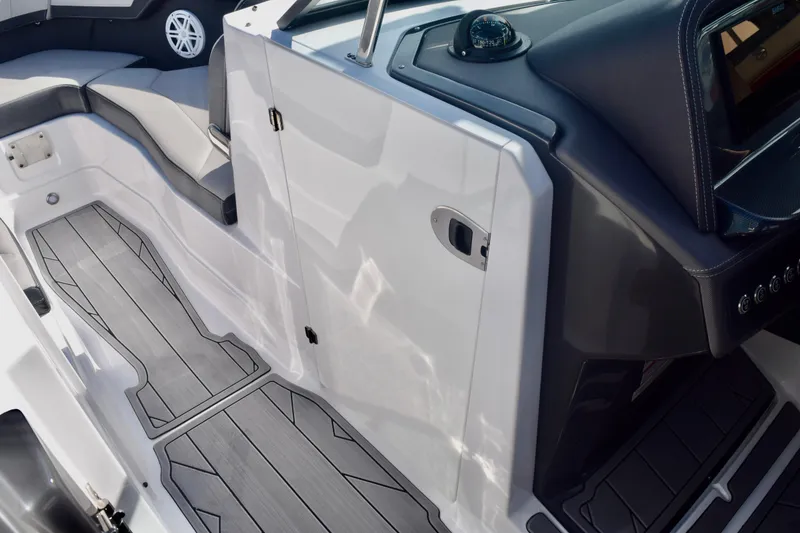 Slide: The Image of 2025 Monterey 275SS Super Sport boat interior with sleek seating and modern dashboard. - 100