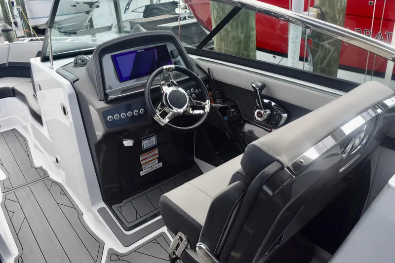 Slide: The Image of 2025 Monterey 275SS Super Sport boat interior with modern dashboard and steering wheel. - 39