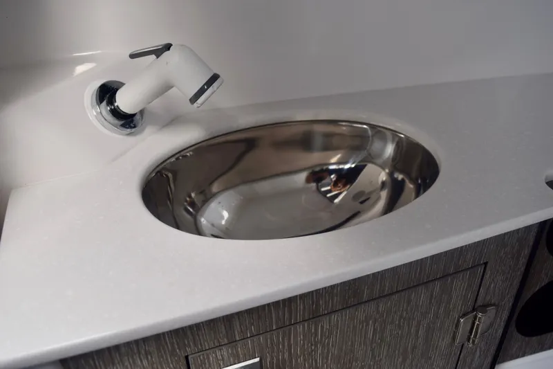 Slide: The Image of Stainless steel sink in 2025 Monterey 275SS Super Sport boat bathroom. - 64