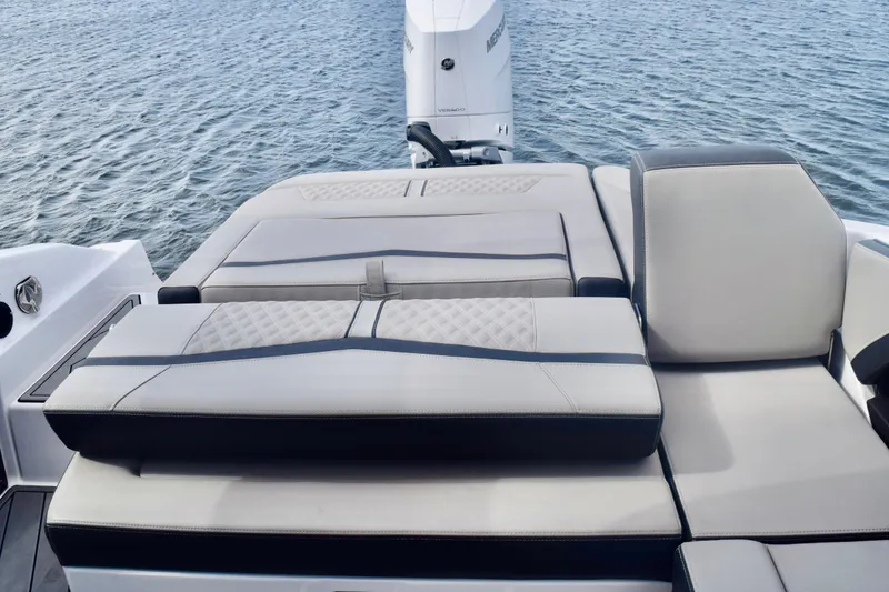 Slide: The Image of 2025 Monterey 275SS Super Sport boat with luxurious seating on calm water. - 40