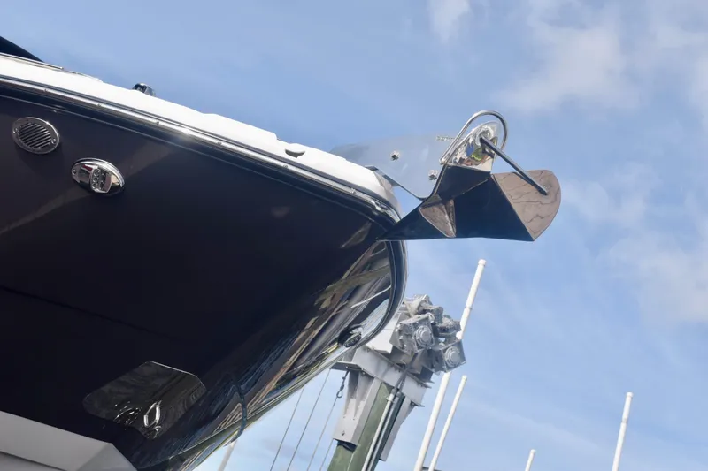Slide: The Image of 2025 Monterey 275SS Super Sport boat bow with anchor against blue sky. - 7