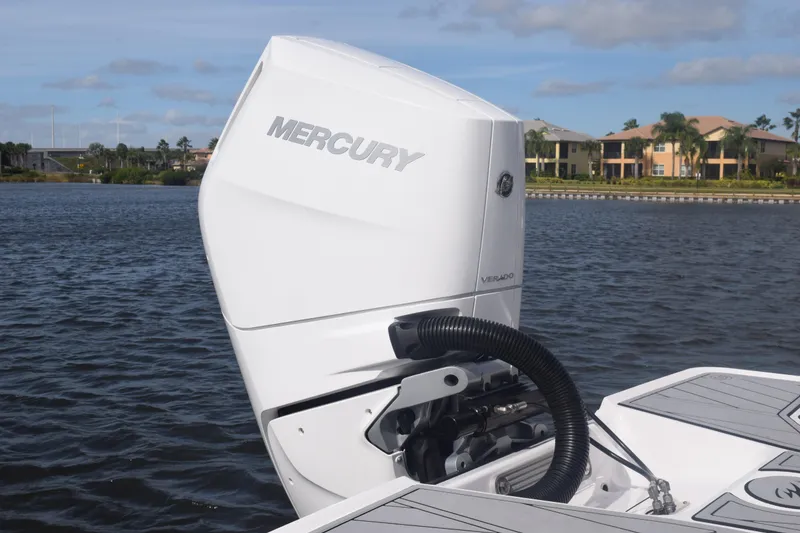 Slide: The Image of 2025 Monterey 275SS Super Sport with Mercury Verado engine on a scenic waterway. - 12
