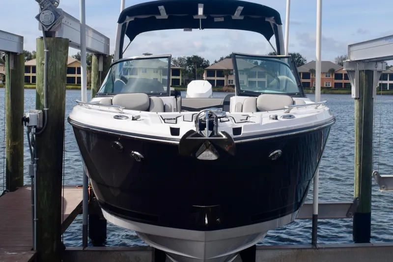 Slide: The Image of 2025 Monterey 275SS Super Sport boat docked on a sunny day. - 19