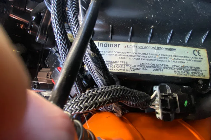 Slide: The Image of Close-up of Indmar engine emission control label on 2017 Tigé RZX3 boat. - 28