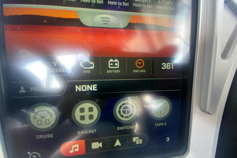 Slide: The Image of 2017 Tigé RZX3 dashboard display showing engine hours and control settings. - 24