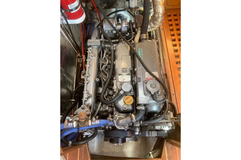 Slide: The Image of Engine compartment of a 2001 Outbound 44/46 sailboat, showcasing detailed mechanical components. - 34