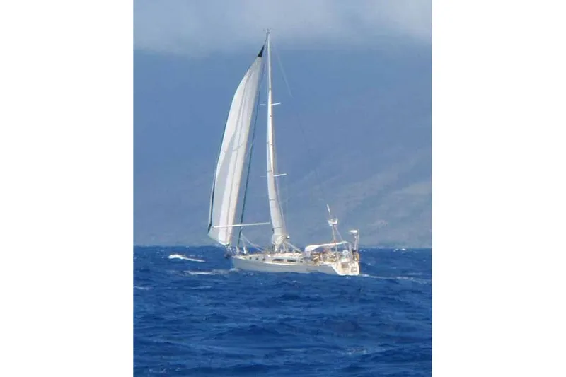 Slide: The Image of Sailing yacht Outbound 44/46 from 2001 navigating open sea under clear skies. - 55