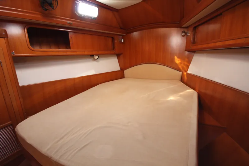 Slide: The Image of Cozy cabin interior of 2001 Outbound 44/46 yacht with wooden finish and comfortable bed. - 19